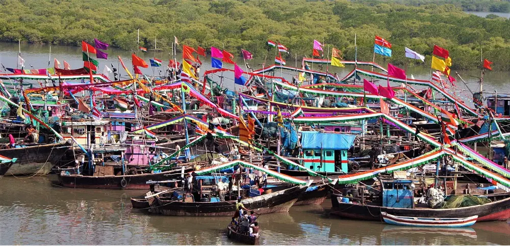 Brightly decorated fishing boats moored together