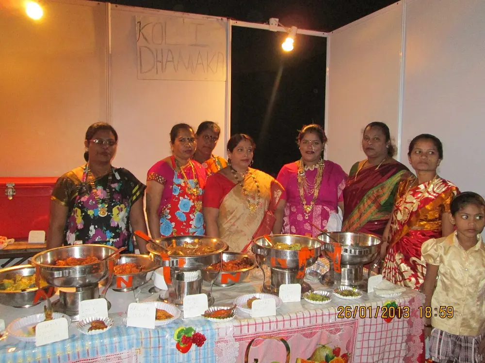Koli women at a community fish stall during a Worli celebration