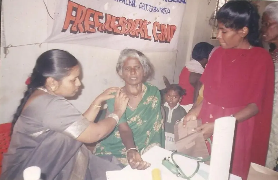 A free village health camp where a doctor examines patients